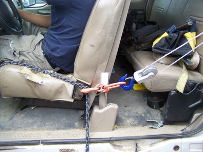 Come-A-Long and chain pulling a seat rearward during extrication picture