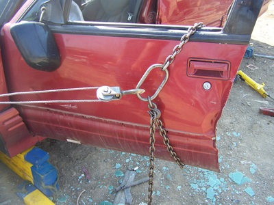 Come-A-Long and chain used in combination to pull a door open picture