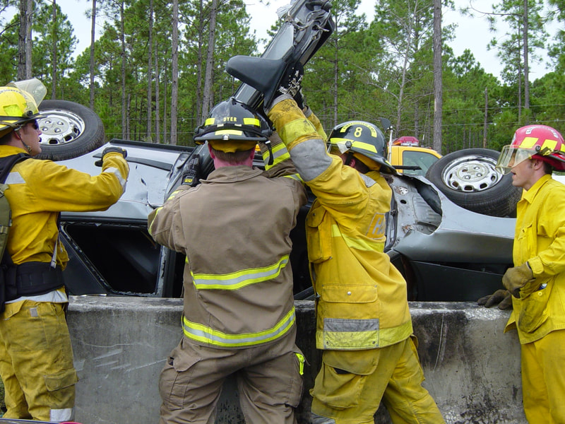 Door being cut from rollover vehicle by Air Gun picture